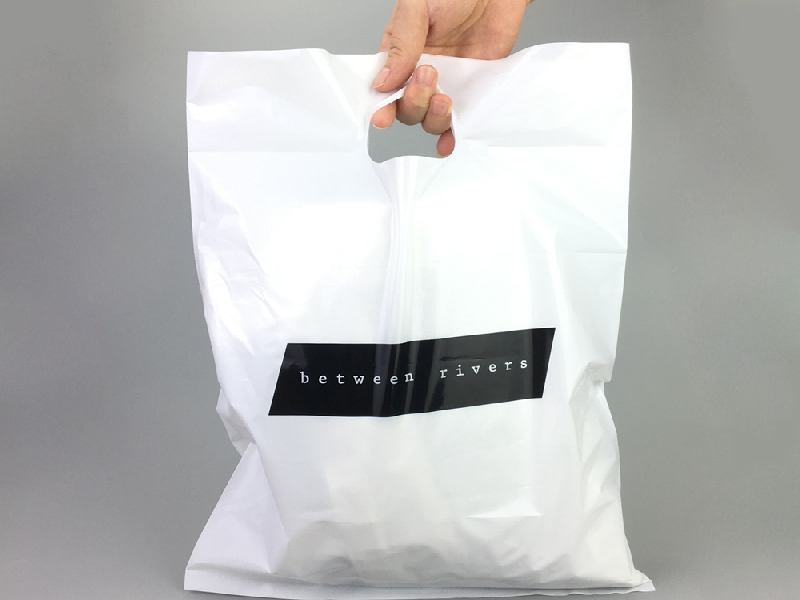 Fold-over die cut plastic bags